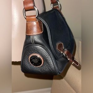 Gently used Dooney and Bourke black and brown leather purse.